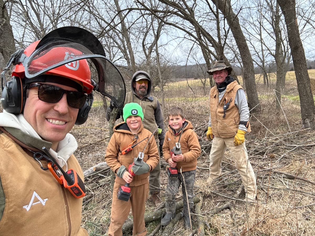 Guys with chainsaws after a day of clearing brush