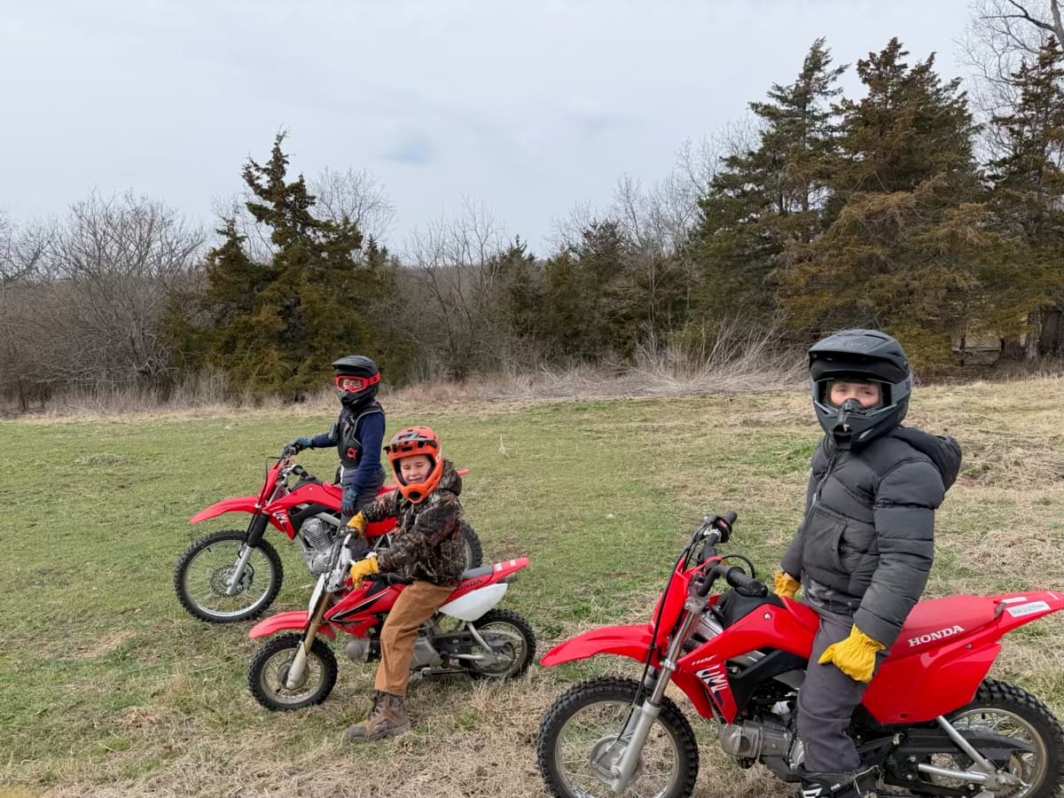 Boys on dirt bikes in the field