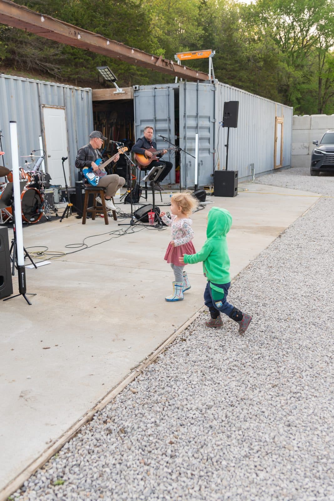 Little kids dancing while the band plays