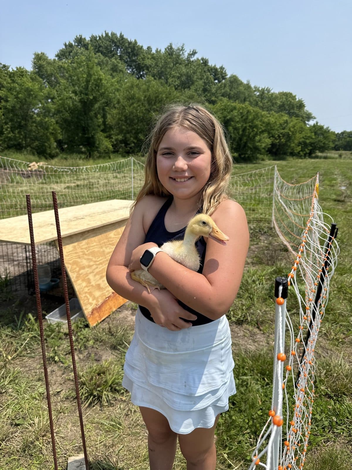 Girl holding a baby chick