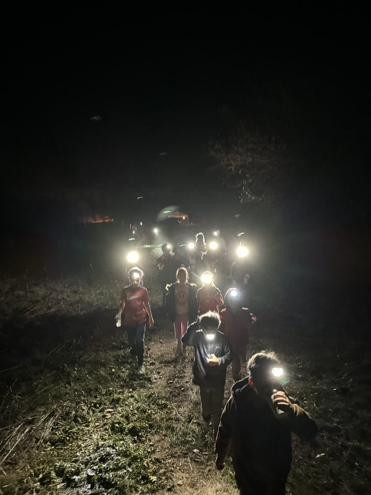 Kids on a nighttime headlamp adventure