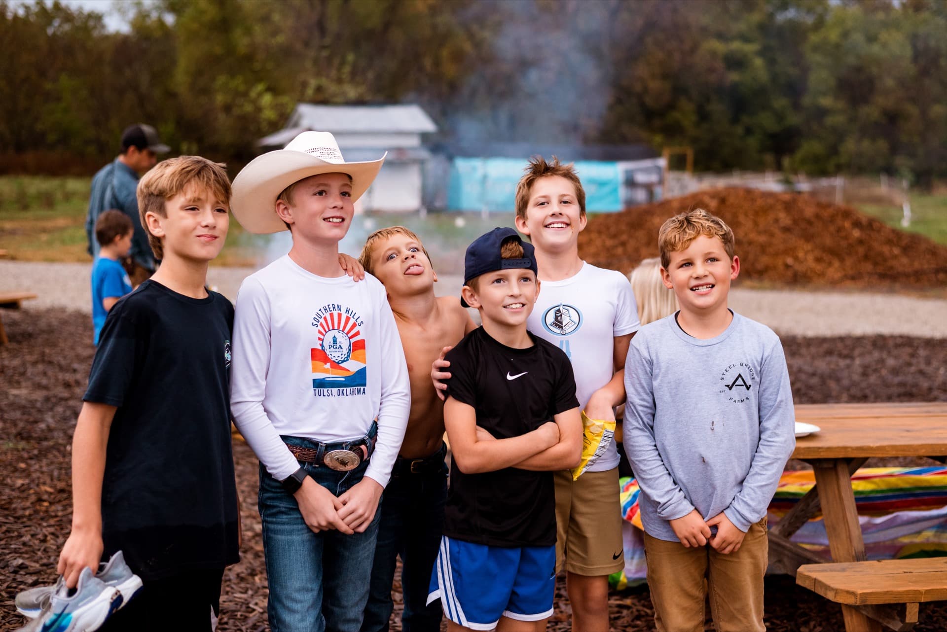 Boys arm in arm with huge smiles